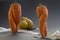 Funny carrots and pearwith measuring tape, diet concept