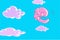 Funny cartoon pink smiling elephant flies in the sky with clouds