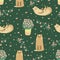 Funny cats in the garden seamless pattern on green.