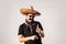 Funny and cheerful man dressed up in traditional mexican sombrero, false moustache, bandana and sunglasses. Humorous festive or h