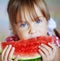 Funny child eating watermelon