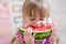 Funny child eating watermelon