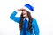 Funny child girl on christmas new year isolated in white. Teenager in santa hat.