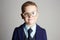 Funny child in glasses. little boy in suit