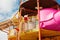 Funny child playing in water park splashing water. Summer holidays concept. Boy has into pool after going down water slide on sum