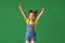 Funny child with raised hands in the air. girl with a Lollipop is funny
