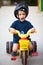 Funny child riding tricycle