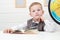 Funny Child in school.little boy with Book, Children Education