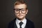 Funny child in suit and glasses