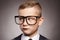 Funny child in suit and glasses