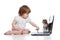 Funny child using a laptop with kitten