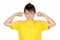 Funny child with yellow t-shirt covering ears