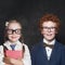 Funny children boy and girl on blackboard background