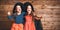 Funny children sister twins girl in witch costume in halloween