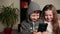 Funny children using smartphone watching video laughing, friendship, childhood