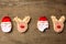 Funny christmas cookies santa and reindeer on wood background