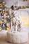 FUNNY CHRISTMAS OR NEW YEAR DOG. The PUPPY is a Dalmatian dog sitting on background of Christmas decorations. Bokeh