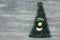 Funny christmas tree against a rustic background