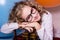 Funny, clever curly teen girl in glasses with wooden abacus on t