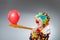 The funny clown in comical concept