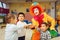 Funny clown and little boys play counting game