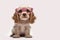 Funny Cocker Spaniel puppy in pink glasses looking at camera.