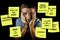 Funny composite of man reading yellow post it notes left by his wife with domestic chores and duties in couple lifestyle