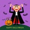 Funny Count Dracula with fangs and a terrible smile, and near a pumpkin pot with sweets and candies.
