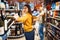 Funny couple in grocery store, alcohol department
