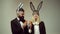 Funny couple rabbit eat carrot. Bunny ears concept with bunny couple. Heppy easter couple.