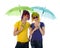 Funny couple with wigs, sunglasses and umbrellas