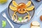Funny crab face shape snack from pancake, orange,apples,honey on plate. Cute kids childrens baby\\\'s sweet dessert, healthy