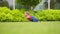 Funny Crawling Baby Toddler Girl On Backyard Lawn Grass.