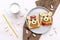 Funny cute bear,dog faces sandwich toast bread with peanut butter, banana, apple,milk, marshmallow. Kids childrens baby`s sweet