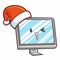Funny and cute personal computer with smiling monitor and wearing Santa`s hat for christmas
