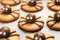 Funny delicious ginger biscuits for Halloween on the table. Set of chocolate Halloween spider cookies on paper for bake and wooden