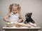 Funny dog and child - cooks.