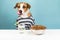 Funny dog in pajamas licking nose at breakfast table. Illustrative concept of puppy in front of bowl of pet food