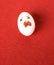 Funny easter emotion egg on red