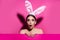 Funny emotions, excited expressing. Bunny woman  on pink.