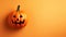 Funny evil pumpkin smiling on orange background