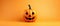 Funny evil pumpkin smiling on orange background