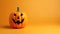 Funny evil pumpkin smiling on orange background