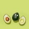 Funny faces avocados on a pastel green background