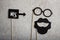 Funny faces formed from black photo boots, mustache and glasses
