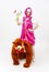 Funny fairy tale girl sitting upwards a man in costume of bear