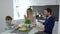 Funny family, boy beats eggs for omelet and parents are delighted