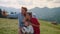 Funny family fooling making selfie on mountains. Parents taking photo with kids