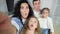 Funny family grimaces making selfies and enjoys life