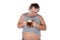 Funny fat man feeling happy and relaxed, holding fresh cold beer in his hands on white background